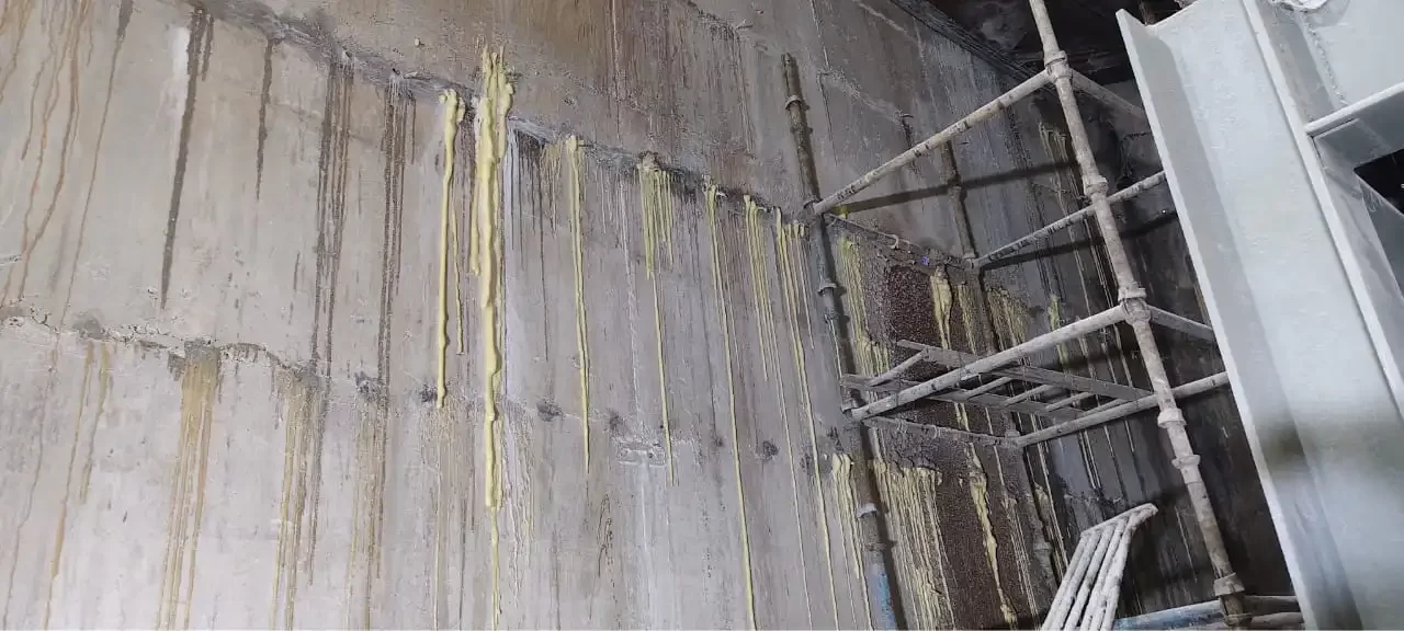 Industrial crack repair using epoxy and polyurethane polymer grouting systems